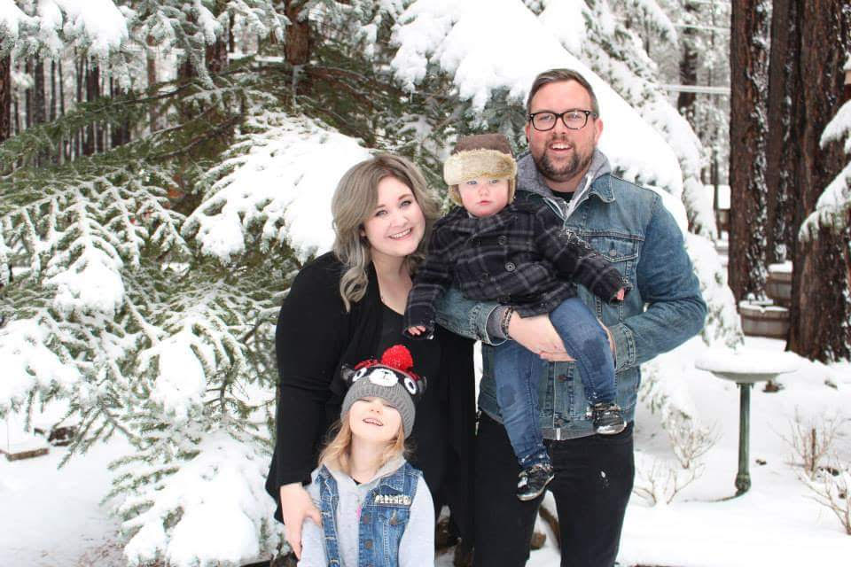 Justine in the snow with her family